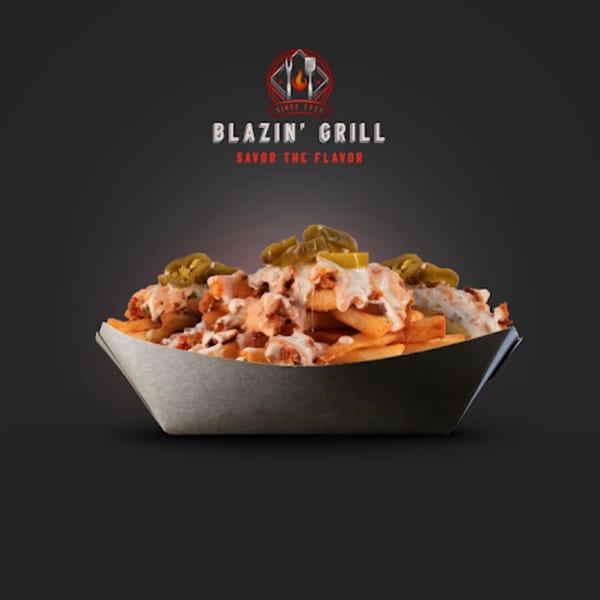 Blazin' Grill's loaded fries topped with chicken, white sauce, and jalapeños in a paper tray.