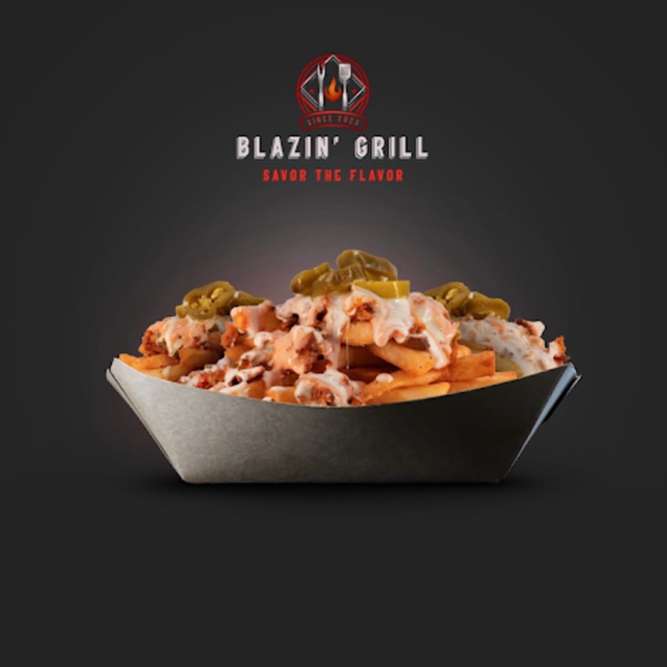 Blazin' Grill's loaded fries topped with chicken, white sauce, and jalapeños in a paper tray.
