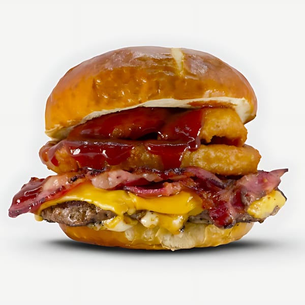 Blazin' Grill's burger with bacon, cheese, onion rings, and barbecue sauce on a pretzel bun.
