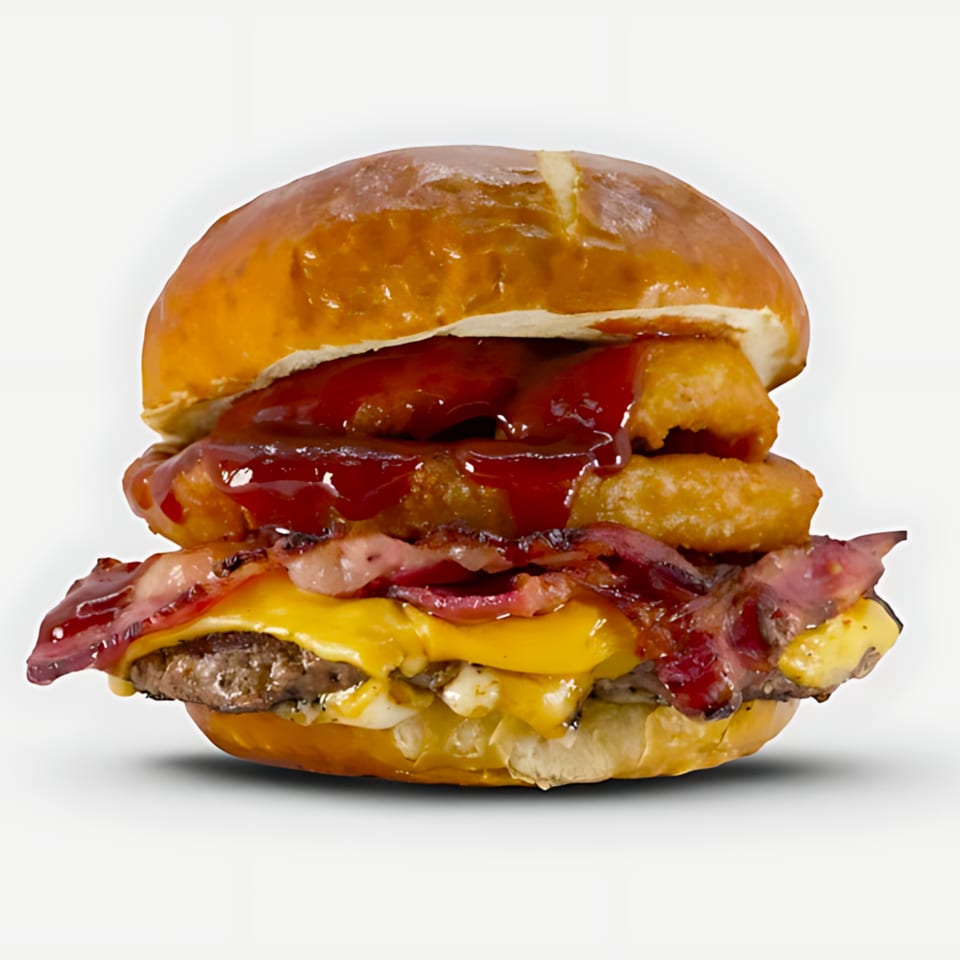 Blazin' Grill's burger with bacon, cheese, onion rings, and barbecue sauce on a pretzel bun.