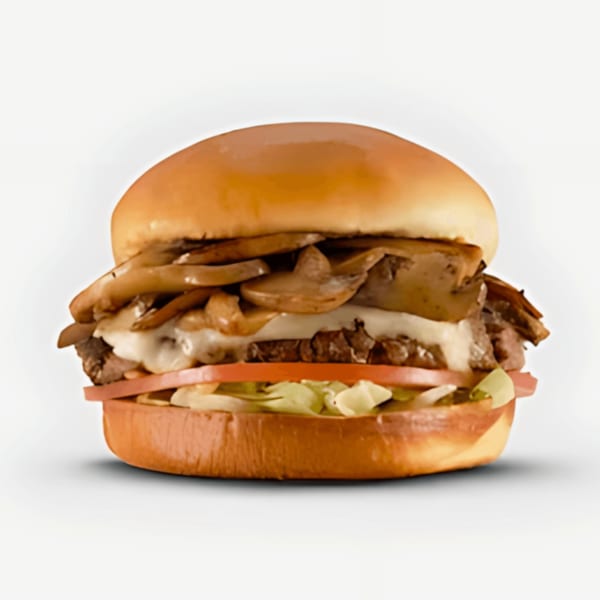 A Blazin' Grill burger with sautéed mushrooms, melted cheese, beef, tomato, and lettuce.