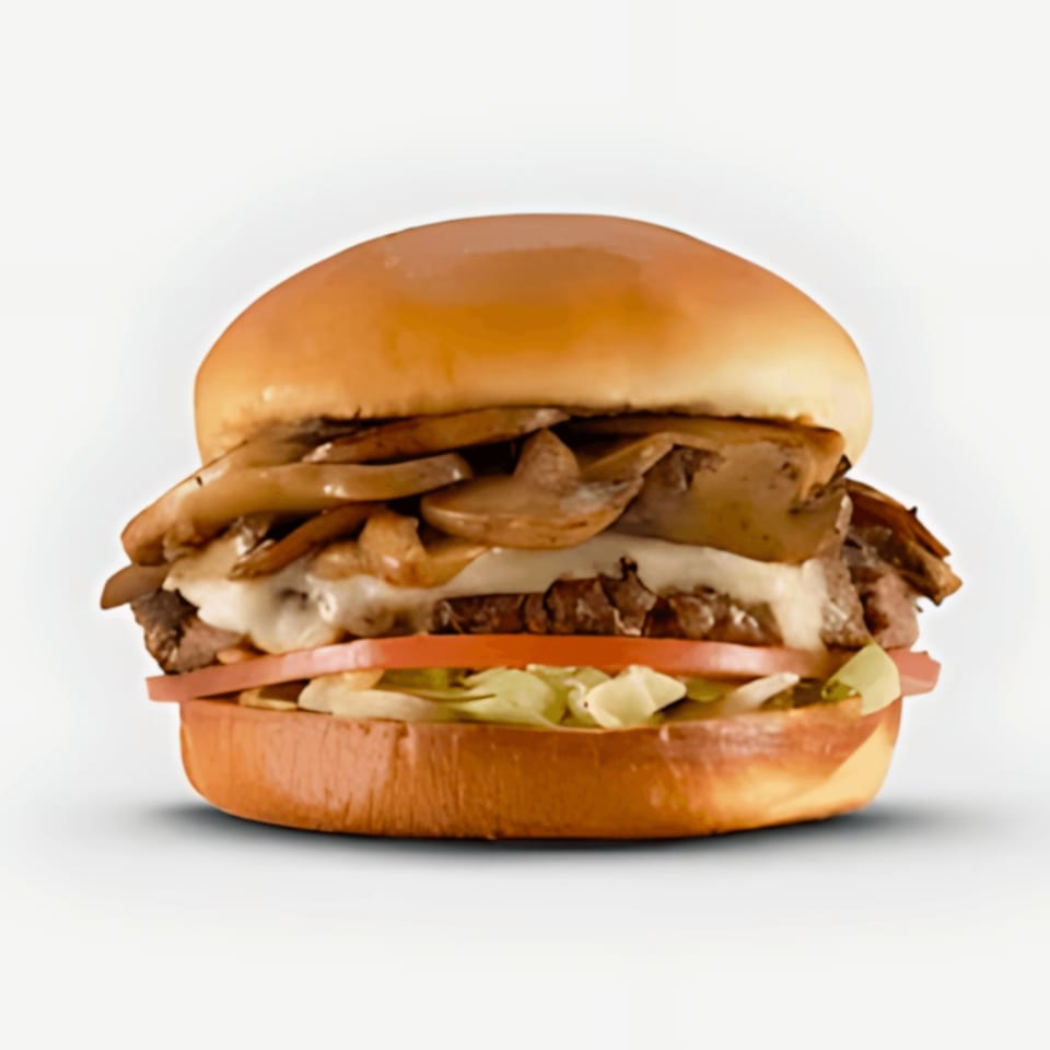 A Blazin' Grill burger with sautéed mushrooms, melted cheese, beef, tomato, and lettuce.